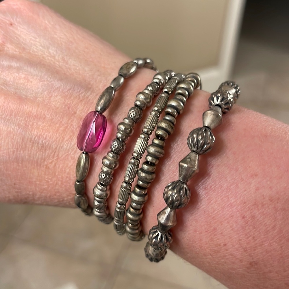 Five Alex & Ani bracelets in antique silver